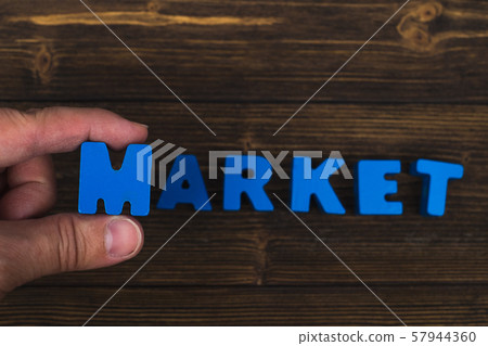 Hand and finger arrange text letters of MARKET Hand and finger arrange text letters of MARKET 57944360