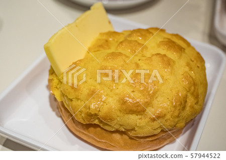 Buttered pineapple bun in dish Buttered pineapple bun in dish 57944522