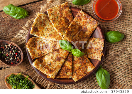 Breadsticks made of cauliflower, cheese and herbs 57945859