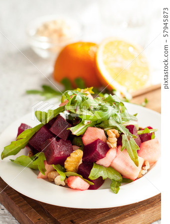 Salad with apple, beet, arugula and walnuts Salad with apple, beet, arugula and walnuts 57945873