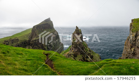 Steep coast in Mykines island, Faroe islands 57946255