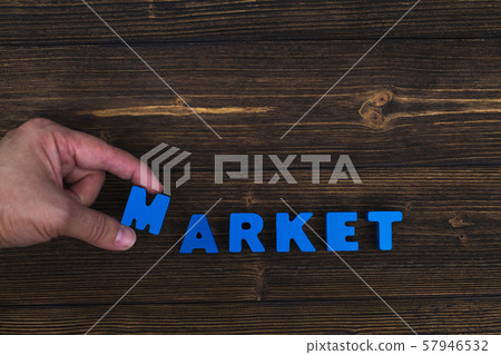 Hand and finger arrange text letters of MARKET 57946532