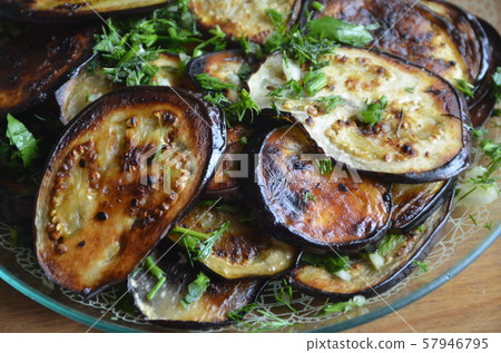 Moldovan fried eggplant with herbs and garlic. Cold appetizer 57946795