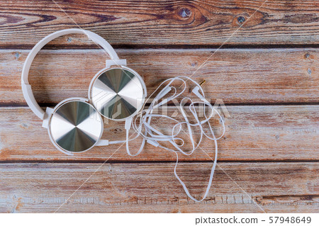 Headphones on wooden desk table. Music concept. 57948649