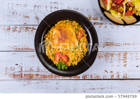 Pasta and rice with chicken and vegetables in 57948789