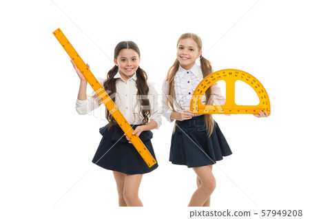 Pupils cute girls with big rulers. Favorite school 57949208