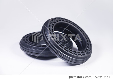 A pair of new thrust bearings absorber car on a gray background. The concept of new car parts and A pair of new thrust bearings absorber car on a gray background. The concept of new car parts and 57949435