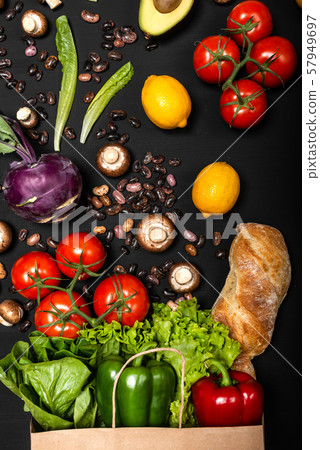 Different fresh vegetables and bread in shopping paper bag. Purchases concept. Healthy food organic 57949697
