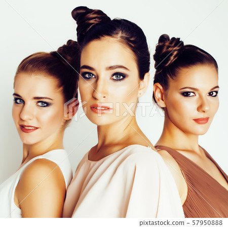 tree pretty stylish young woman with same hairstyle and makeup, best friend together having fun 57950888