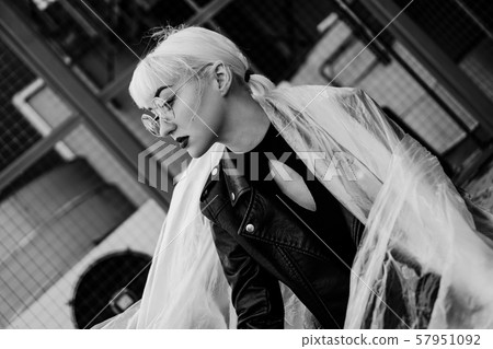 Ecology concept. Girl with plastic wrap. City Style. 57951092