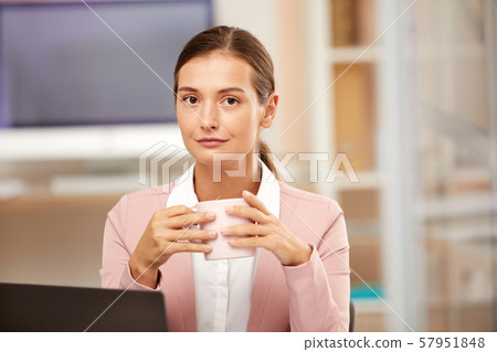 Businesswoman drinking coffee Businesswoman drinking coffee 57951848