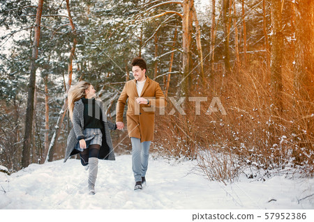 happy couple walking through the park 57952386