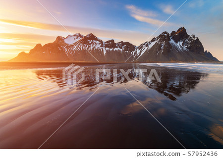 Sunset at Vestrahorn Mountain and Stokksnes beach. Iceland 57952436