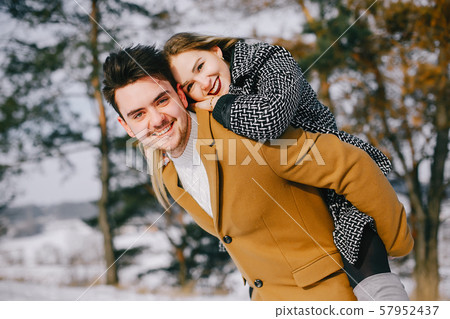 happy couple walking through the park happy couple walking through the park 57952437