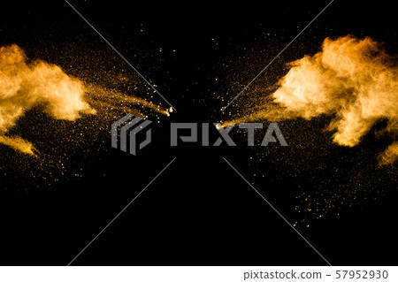 Abstract explosion of orange dust on black background. Freeze motion of orange powder splashing. 57952930