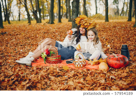 Cute and stylish family in a autumn park 57954189
