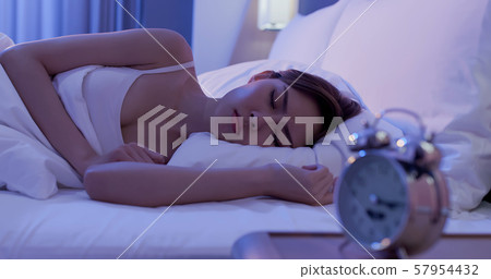 woman insomnia on bed 57954432