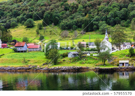 Reflection of houses in a norwegian fjord 57955570