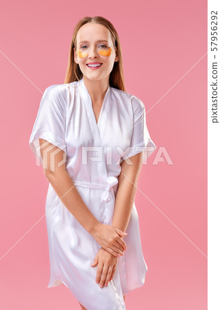 Beautiful lady with mask for the skin around the Beautiful lady with mask for the skin around the 57956292