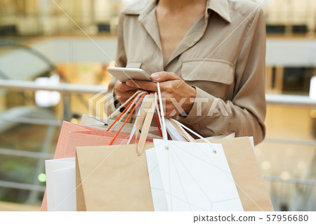 Woman with shopping bags 57956680