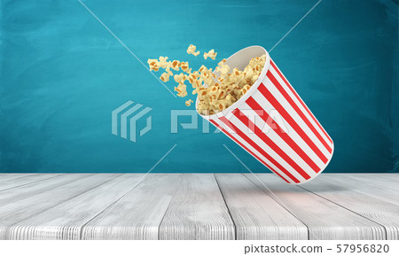 3d rendering of popcorn bucket on wooden surface near blue wall with copy space. 3d rendering of popcorn bucket on wooden surface near blue wall with copy space. 57956820