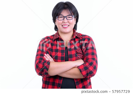 Happy overweight Asian hipster woman smiling with arms crossed 57957729