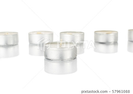 Waxy tea candle isolated on white Waxy tea candle isolated on white 57961088