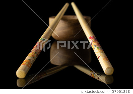 Asian chopsticks isolated on black glass 57961258