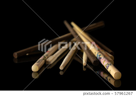 Asian chopsticks isolated on black glass Asian chopsticks isolated on black glass 57961267
