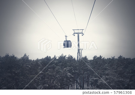 funicular in bad weather stuck over the forest. funicular in bad weather stuck over the forest. 57961308
