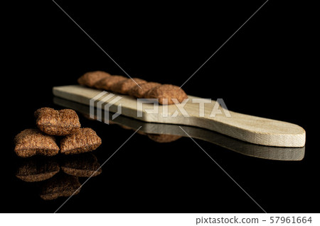 Crispy cereal pillow isolated on black glass Crispy cereal pillow isolated on black glass 57961664