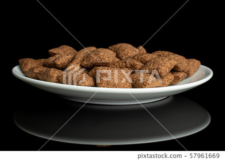Crispy cereal pillow isolated on black glass Crispy cereal pillow isolated on black glass 57961669