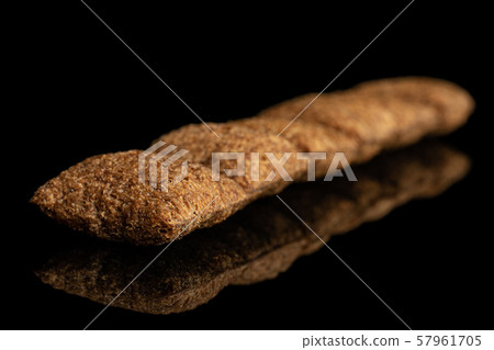 Crispy cereal pillow isolated on black glass Crispy cereal pillow isolated on black glass 57961705