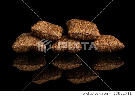 Crispy cereal pillow isolated on black glass Crispy cereal pillow isolated on black glass 57961711