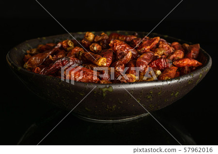 Dry red pepperoncino pepper isolated on black Dry red pepperoncino pepper isolated on black 57962016