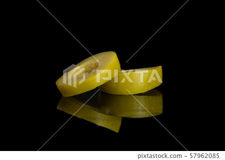 Pitted green olive isolated on black glass Pitted green olive isolated on black glass 57962085