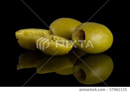 Pitted green olive isolated on black glass 57962135