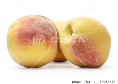 Fresh fuzzy peach isolated on white Fresh fuzzy peach isolated on white 57962218