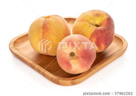 Fresh fuzzy peach isolated on white Fresh fuzzy peach isolated on white 57962262