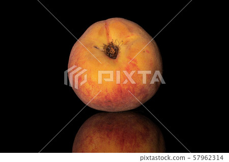 Fresh fuzzy peach isolated on black glass Fresh fuzzy peach isolated on black glass 57962314