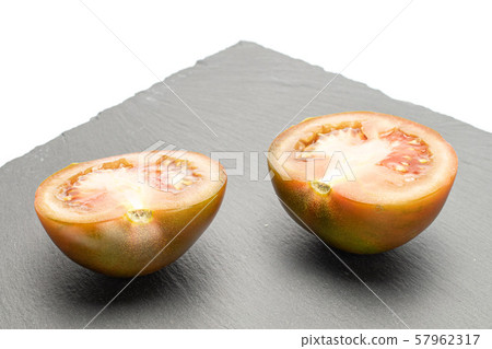 Fresh green red tomato isolated on white Fresh green red tomato isolated on white 57962317