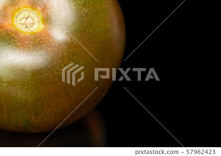 Fresh green red tomato isolated on black glass Fresh green red tomato isolated on black glass 57962423