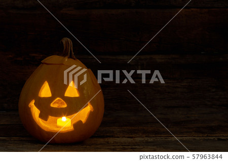 Halloween pumpkin with burning candle. Halloween pumpkin with burning candle. 57963844