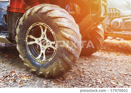 ATV in the forest, in the mud. Wheels and ATV ATV in the forest, in the mud. Wheels and ATV 57970602