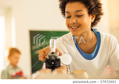 Close up of kind boy that using microscope Close up of kind boy that using microscope 57972601