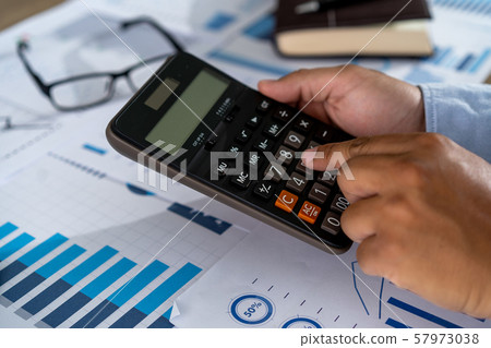 businessman working using a calculator finance businessman working using a calculator finance 57973038