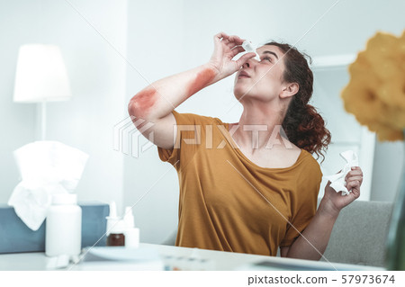 Woman using self-medication while having strong allergy 57973674
