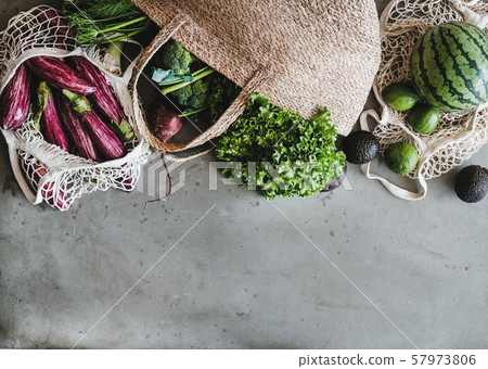 Eco-friendly jute bags full of fresh vegetables 57973806