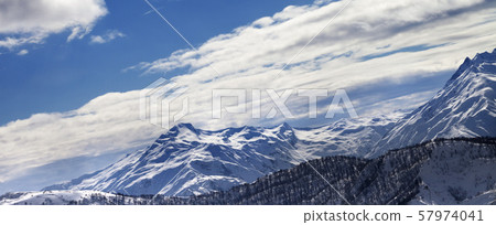 Off-piste slope and snow winter mountains in sun Off-piste slope and snow winter mountains in sun 57974041