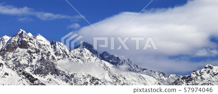 Snow winter mountains and blue sky with clouds at Snow winter mountains and blue sky with clouds at 57974046